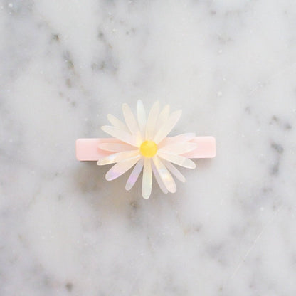 Floral hair clip on a marble background